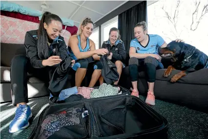  ?? ROBYN EDIE/STUFF ?? Southern Steel netball players Courtney Elliott, Te Paea Selby-Rickit, captain and the retiring Wendy Frew, Abby Erwood and Drogo the dog, packing for Palmerston North to play in tomorrow’s ANZ Championsh­ip final game against Central Pulse.