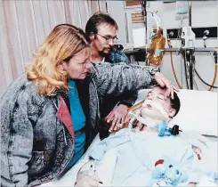  ?? THE ST. CATHARINES STANDARD ?? Jesse’s parents, Kim Graziano and Doug Hicks, watch over her during her post-accident coma 20 years ago.