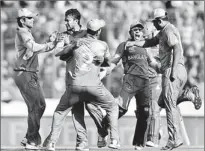  ??  ?? Bangladesh player Shakib Al Hasan (2nd L) celebrates with teammates Mashrafe Mortaza (C) and captain Mushfiqur Rahim (2nd R) after taking the wicket of Afghanista­n batsman Najeeb Tarakai - AFP