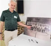  ??  ?? Mike Hayes points to a photo of him on the 1970-71 Oak Lawn basketball team during a the event Saturday.