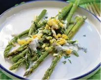  ?? GRETCHEN MCKAY / PITTSBURGH POST-GAZETTE / TNS ?? A simple asparagus salad with grated egg and yogurt sauce is an elegant side dish.