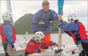  ?? B31sail10 ?? The participan­ts help prepare the boat for the day’s sailing.