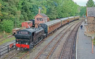  ?? ?? At Highley station, No. 6045, second from the end, looks perfectly at home on a GWR rake hauled by pannier No. 1501.