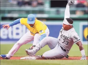  ?? Adam Glanzman / Getty Images ?? The White Sox’s Yermin Mercedes, right, is tagged out at second base by the Red Sox’s Christian Arroyo on Saturday.