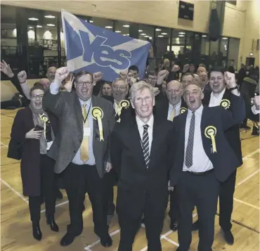  ??  ?? 0
Kenny Macaskill celebrates with supporters after winning the East Lothian seat at the election