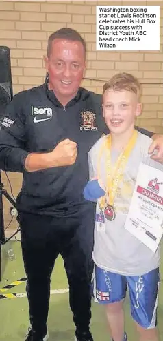  ??  ?? Washington boxing starlet Lewis Robinson celebrates his Hull Box Cup success with District Youth ABC head coach Mick Wilson
