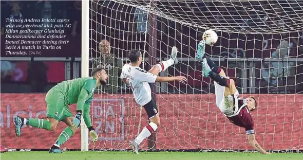 ??  ?? Torino’s Andrea Belotti scores with an overhead kick past AC Milan goalkeeper Gianluigi Donnarumma and defender Ismael Bennacer during their Serie A match in Turin on Thursday. EPA PIC