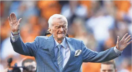  ?? AP FILE ?? Former voice of the Tennessee Vols, John Ward, is recognized during a timeout in a college football game between Tennessee and Vanderbilt in Knoxville. Ward, who served as the radio voice of Tennessee football and menâs basketball for over three decades, has died. He was 88. Vol Network tweeted that Ward died Wednesday in Knoxville.