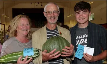  ??  ?? Aislinn, David and Daithi Medcalf with David’s prize winning marrow and courgette.