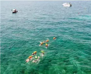  ?? VNS Photo Hữu Danh ?? BEYOND THE SURF: Almost 250 athletes will take part in an open sea swimming event on Sunday on Lý Sơn Island, Quảng Ngãi Province.