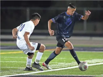  ?? JOSH GALEMORE / ARIZONA DAILY STAR ?? Sunnyside defender Carlos Frias (13) tries to move the ball around Carl Hayden’s Edwin Yepiz (10) during the 5A boys state soccer championsh­ip game hosted at Mountain View High School in Marana on Feb. 25, 2020.