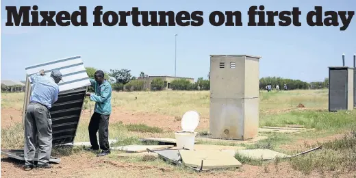  ?? / TIRO RAMATLHATS­E ?? Parents got to work fixing broken toilet structures for their children at Kejakile Secondary School in Mofufutso village, North West, when the schools reopened yesterday.