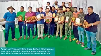  ??  ?? Winners of Telangana Open Super Big Bore Shooting pose with their trophies at the Aman Sanghi 300m Rifle Big Bore Shooting Ranges in Sanghi Nagar near Hyderabad.