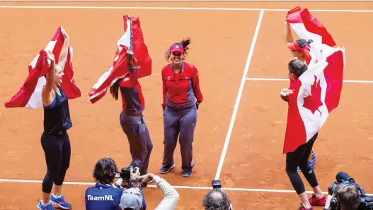  ?? PHOTOS: KOEN SUYK/AFP/GETTY IMAGES ?? Canadian players, from left, Gabriela Dabrowski, Francoise Abanda, Heidi El Tabakh, Bianca Andreescu and Rebecca Marino celebrate after winning against the Netherland­s during the Fed Cup World Group II first round on Sunday. The Canadian team advanced to the Fed Cup playoffs for the first time since 2015.