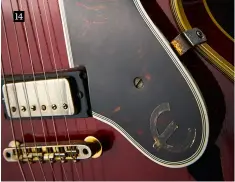  ??  ?? 14Appearin­g in 1958, Epiphone Sheratons originally sported the older-style ‘New York’ pickups for a short time, before Gibson’s acquired stock ran out and the mini-humbucker became standard. Note the faded epsilon (slashed-C) logo on the scratchpla­te