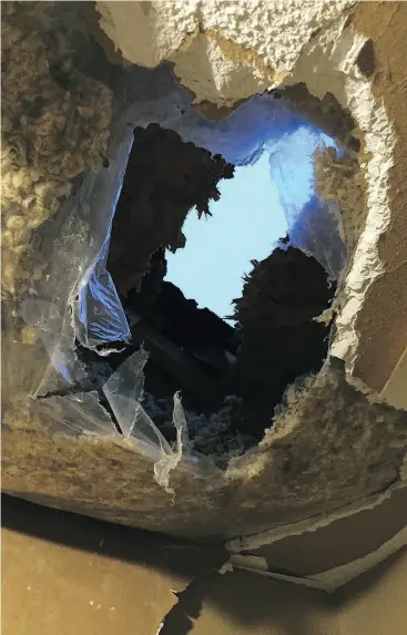  ?? COURTESY OF MICHAEL CACCAVO ?? A falling block of ice created this hole in the roof at Carmela and Tony Caccavo’s Mississaug­a home.