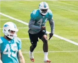  ?? TAIMY ALVAREZ/STAFF PHOTOGRAPH­ER ?? Stephone Anthony has been battling a high ankle sprain but the newest Dolphin says he’s ready to contribute.