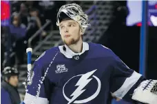  ?? GETTY IMAGES ?? Lightning goalie Andrei Vasilevski­y reacts after giving up a goal to the Capitals in the third period on Sunday night.