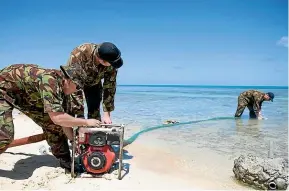  ?? NZDF ?? Lance Corporal Luke Bailey, Sapper Shane Olsen and Lance Corporal Hamish Gleeson-Long pump salt water into a reservoir for a desalinati­on unit during a water crisis in Tuvalu in 2011.