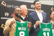  ?? Associated Press ?? Former UConn star Kemba Walker, left, poses with Celtics GM Danny Ainge and new Celtics teammate Enes Kanter at introducto­ry press conference on Wednesday.