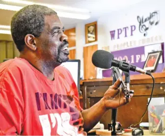  ??  ?? Inside a former classroom at the old Piney Woods Elementary, now the Chattanoog­a Civic Center at Mountainsi­de, program director Terry Neal talks about the launch of WPTP-FM, which began broadcasti­ng in March.