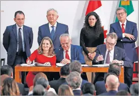  ?? [AP PHOTO] ?? From left, Deputy Prime Minister of Canada Chrystia Freeland, Mexico's top trade negotiator Jesus Seade and U.S. Trade Representa­tive Robert Lighthizer sign an update to the North American Free Trade Agreement last month at the national palace in Mexico City.