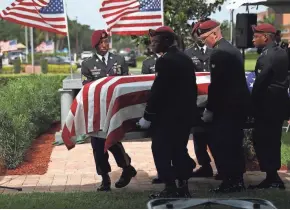  ?? IMAGES JOE RAEDLE/GETTY ?? U.S. Military honor guards carry the casket of U.S. Army Sgt. La David Johnson during his burial service at the Memorial Gardens East cemetery in Hollywood, Fla., on Saturday.
