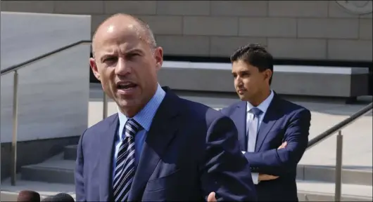  ?? AP PHOTO/RICHARD VOGEL ?? In this July 27, file photo Michael Avenatti, the attorney for porn actress Stormy Daniels replies to questions by reporters during a news conference in front of the U.S. Federal Courthouse in Los Angeles.