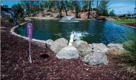  ?? ?? The Lakes at Hemet West's nine-hole golf course and ponds now are using recycled water as grass near homes has been replaced with drought-tolerant landscapin­g.