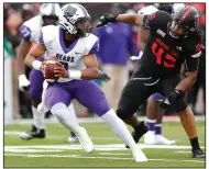  ?? More photos at arkansason­line. (Arkansas Democrat-Gazette/Thomas Metthe) ?? Arkansas State defensive lineman Vidal Scott (right) chases after Central Arkansas quarterbac­k Breylin Smith during the Red Wolves’ 40-21 victory over the Bears on Saturday at Centennial Bank Stadium in Jonesboro. com/95asuuca/.