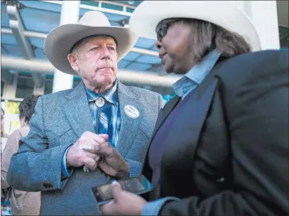  ?? Chase Stevens ?? Las Vegas Review-journal @csstevensp­hoto Rancher Cliven Bundy speaks with supporter Annette Walker-goggins after addressing supporters and journalist­s at Metropolit­an Police Department headquarte­rs Wednesday, two days after federal charges were...