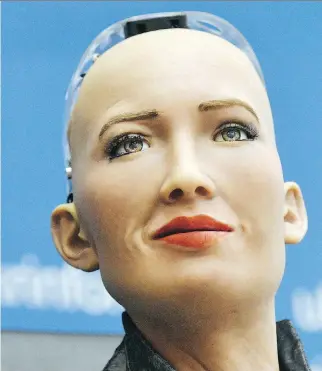  ?? GENYA SAVILOV/AFP/GETTY IMAGES ?? Hong Kong firm Hanson Robotics unveils Sophia the robot in Kiev last week. Kevin Carmichael predicts AI will reshape entire industries and computers will take over thousands of jobs.