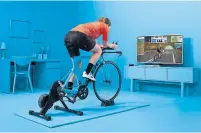  ??  ?? The Zwift app features “live” rides in which you can join athletes from all over the world. If you need a dose of exercise inspiratio­n, it’s easy to find online — or on your phone.