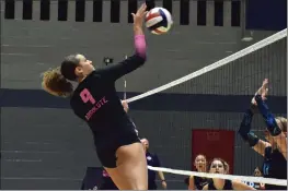  ?? PHOTOS BY SHUN GRAVES ?? Preslie Yates (9) of Absolute Volleyball Club spikes in a kill as 17Black competed in brackets at the Girls Junior National Championsh­ip at Chicago's McCormick Place on Thursday. The tournament capped off the club volleyball season.