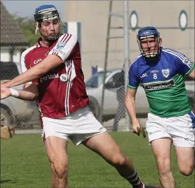  ??  ?? Ed O’Byrne of St. Martin’s strikes for goal as Mark Flood (Glynn-Barntown) watches.