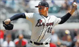  ?? John Bazemore ?? The Associated Press Sean Newcomb, shown in the first inning Sunday, held the Dodgers hitless for 8⅔ innings in the Braves’ 4-1 win, before old, insensitiv­e tweets by him surfaced.