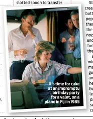  ??  ?? It’s time for cake at an impromptu birthday party for a valet, on a plane in Fiji in 1985