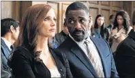  ?? MICHAEL GIBSON/STXFILMS VIA AP ?? This image released by STXfilms shows Idris Elba, right, and Jessica Chastain in a scene from “Molly’s Game.”