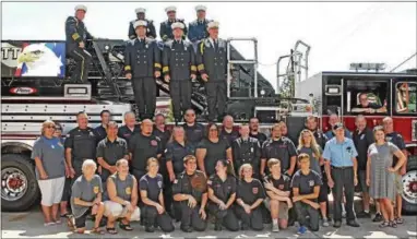  ?? CHRIS BARBER — DIGITAL FIRST MEDIA ?? Members of the Kennett Fire Company pose with their new truck on Saturday.