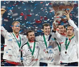  ??  ?? Win: Evans, second left, with the Davis Cup team in 2015