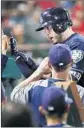  ?? Gina Ferazzi Los Angeles Times ?? C.J. CRON gets a warm welcome in dugout after hitting a solo home run.
