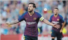  ?? MANU FERNANDEZ THE ASSOCIATED PRESS ?? Lionel Messi celebrates after scoring during the Champions League match between FC Barcelona and PSV Eindhoven on Tuesday.