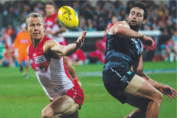  ?? Picture: COLLEEN PETCH ?? STELLAR CAREER: Ryan O’Keefe, here taking a great mark over Geelong’s Jimmy Bartel in 2013, was inducted into the Swans’ Hall of Fame last night.