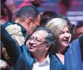  ?? COURTESY ?? Newly elected Colombian President Gustavo Petro celebrates with his wife, Veronica Alcocer, at the Movistar Arena in Bogota on Sunday after winning the presidenti­al runoff election.