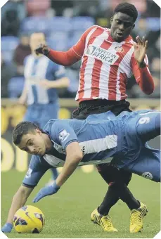  ??  ?? Wigan’s Franco Di Santo goes flying under a challenge from Sunderland midfielder Alfred N’Diaye