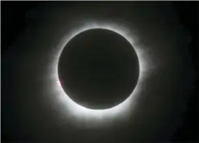  ?? FILE — THE ASSOCIATED PRESS ?? This file photo shows a total solar eclipse in Belitung, Indonesia. A solar eclipse on Monday is set to star in several special broadcasts on TV and online. PBS, ABC, NBC, NASA Television and the Science Channel are among the outlets planning extended...