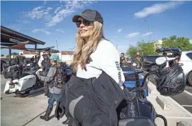  ?? TOM TINGLE/THE REPUBLIC ?? Karen Davidson, creative director of general merchandis­e for Harley-Davidson, gets ready to ride her 2019 Road King Special on Wednesday outside the Harley-Davidson dealership in Scottsdale, Arizona. Davidson is the great-granddaugh­ter of Harley-Davidson co-founder William A. Davidson.