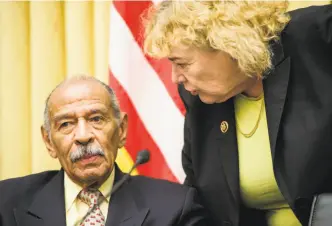  ?? Bill Clark / CQ Roll Call 2015 ?? John Conyers and Zoe Lofgren confer at a 2015 Judiciary Committee hearing. Conyers has temporaril­y given up his post as ranking Democrat while denying a sexual harassment claim.