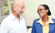  ??  ?? Douglas Orane, patron of Child Month, chats with Dr Pauline Mullings, chairperso­n of the National Child Month Committee.