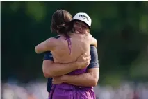  ?? LM OTERO/ASSOCIATED PRESS ?? Sam Burns, right, hugs his wife, Caroline, after winning the Charles Schwab Challenge golf tournament at the Colonial Country Club in Fort Worth on Sunday.